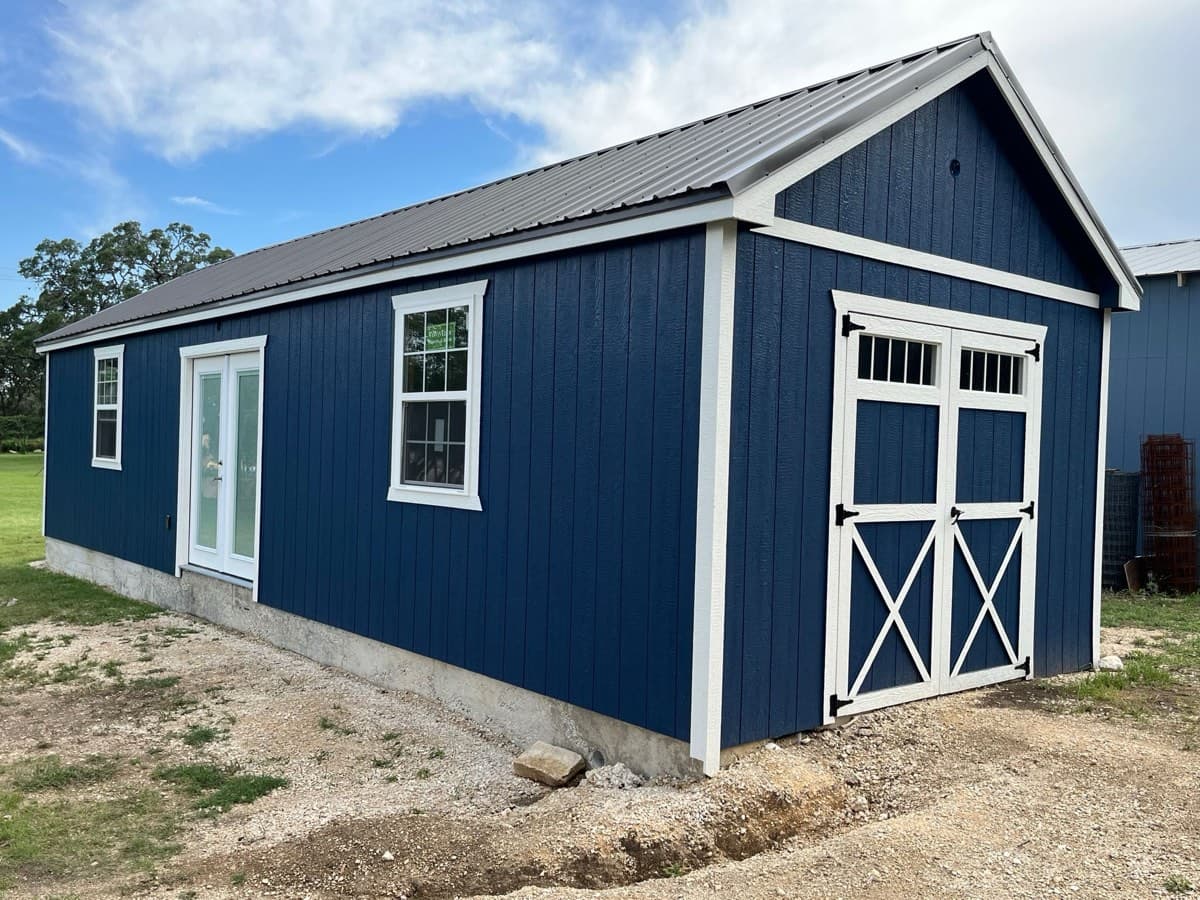 Dual-purpose shed for storage and home entertainment - blue exterior