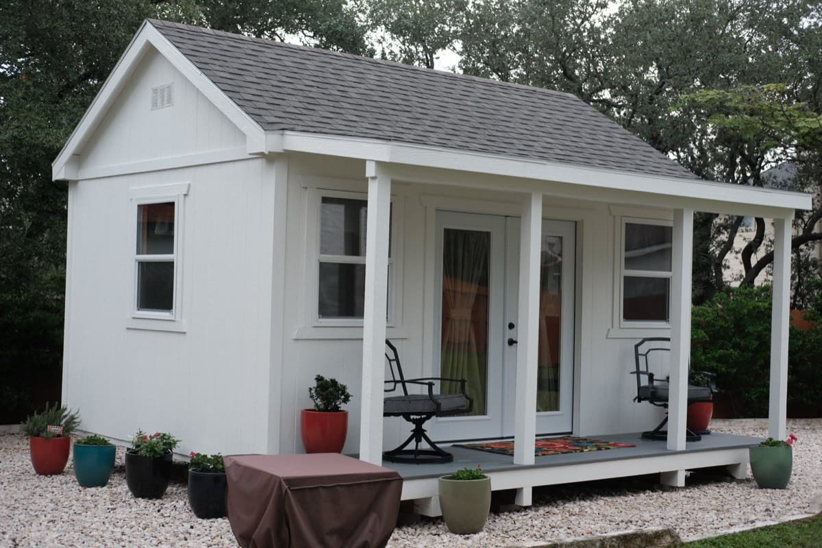 Custom kids playhouse with patio - white wooden outdoor structure